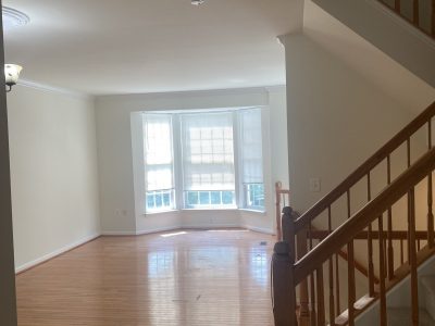 big room with large windows interior neutral colors