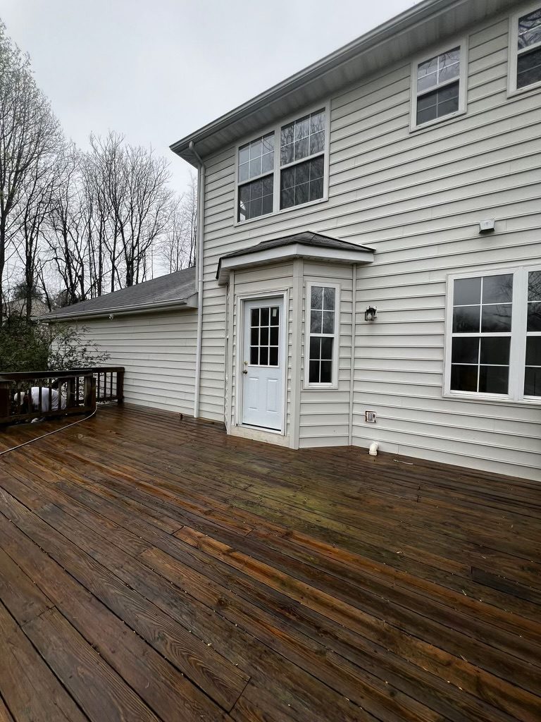 home with white siding before painting Preview Image 2