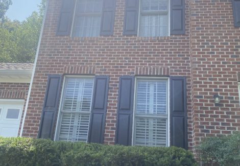 grey shutters on brick home in fredericksburg
