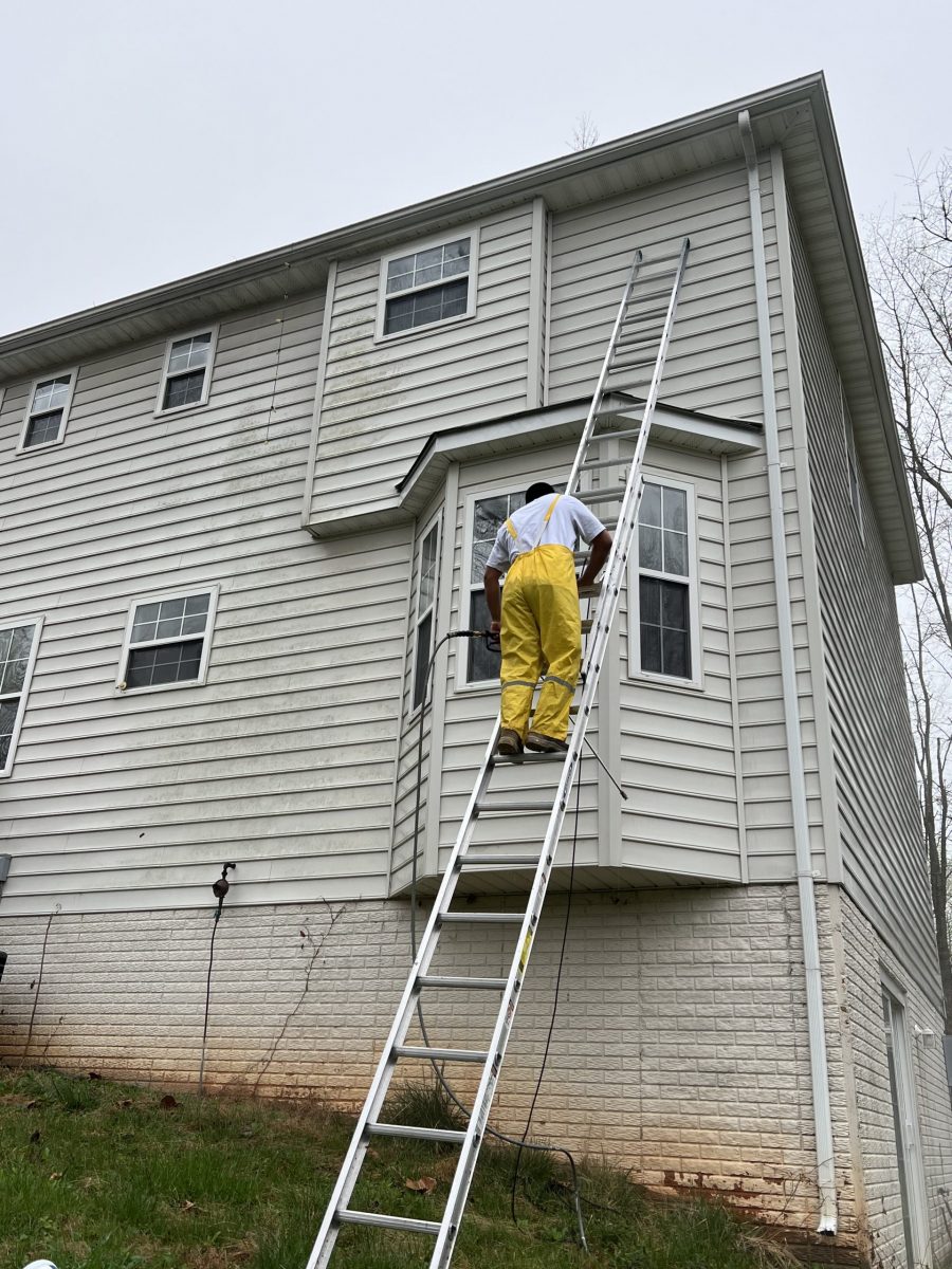 home with white siding during painting Preview Image 1