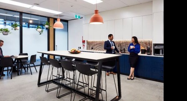 coworkers in office break room