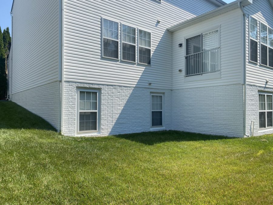 home with white siding and brick foundation Preview Image 5