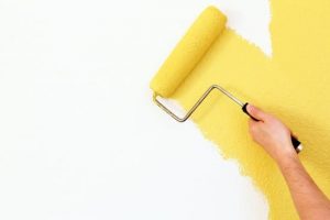 paint roller painting wall