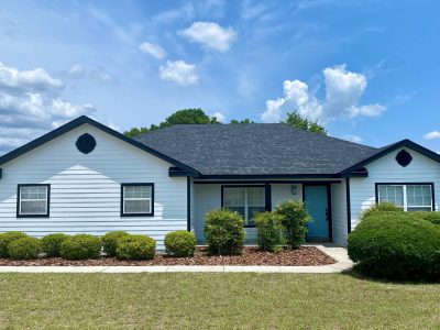 White Home Blue Front Door Painting