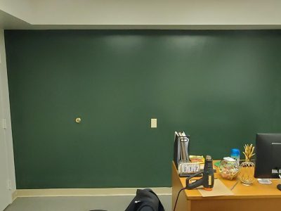 green accent wall in office space