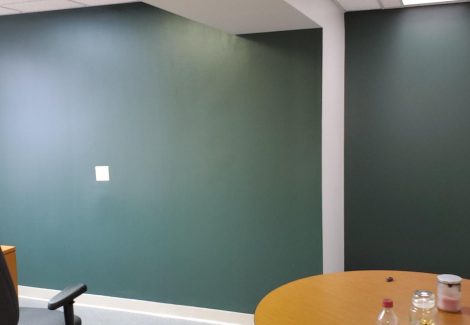 green accent wall in office space