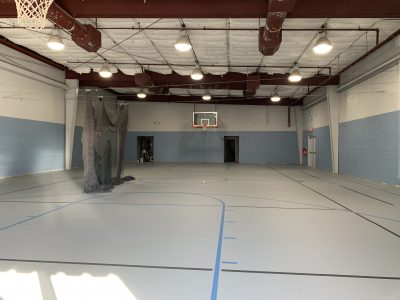 white and blue painted walls of the Collierville gym interior after the repainting work was complete