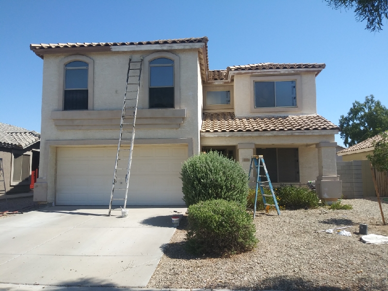 Stucco home before repainting