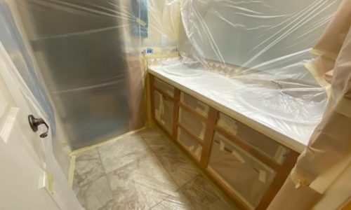 The bathroom cabinet front just before spraying