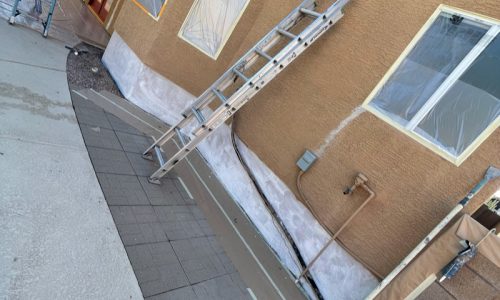 Stucco cracks running up the walls.