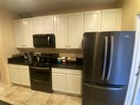 Kitchen cabinets with new white finish