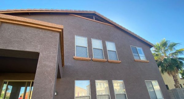 Stucco house with new paint and trim colors.