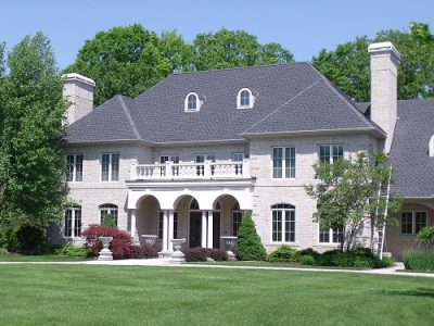 Exterior house painting by CertaPro painters in Ada, MI