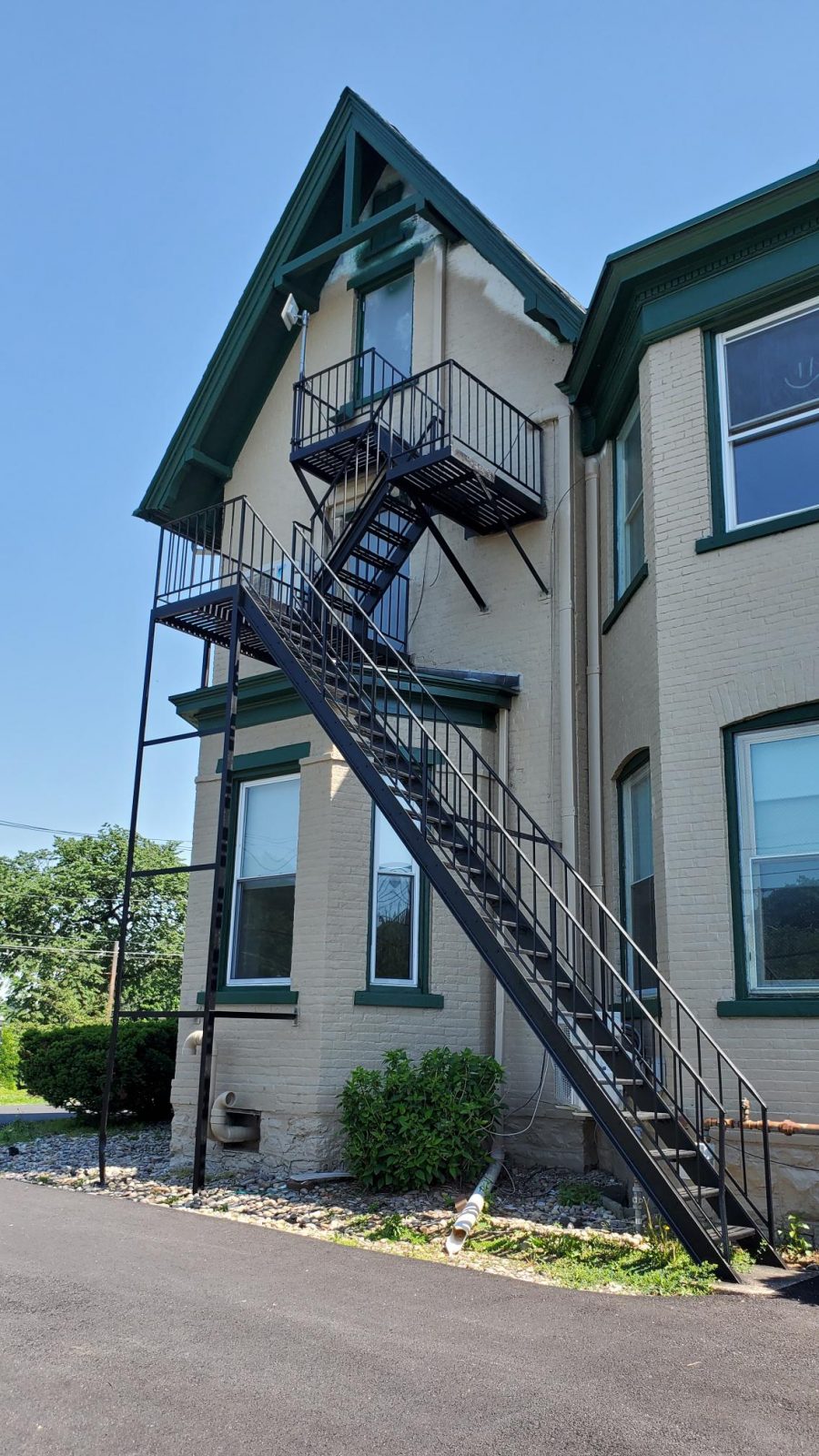 Fire Escape at Equinox Property Management in Bethlehem, PA, after completed commercial exterior painting project by CertaPro Painters of the Greater Lehigh Valley - Angle 2 Preview Image 2