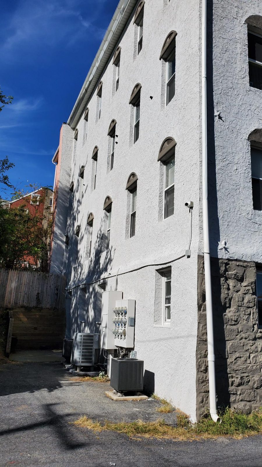 Side Angle of River Rock Management after completed commercial exterior painting project by CertaPro Painters of the Greater Lehigh Valley Preview Image 1