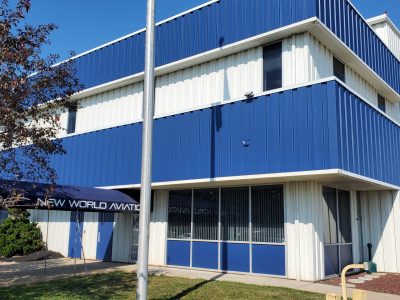 Front corner angle of completed commercial exterior painting project at New World Aviation in Allentown, PA, by CertaPro Painters of the Greater Lehigh Valley - Angle 2