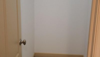 Closet with white walls and tan doors in Easton, PA, after completed residential interior painting project by CertaPro Painters of the Greater Lehigh Valley