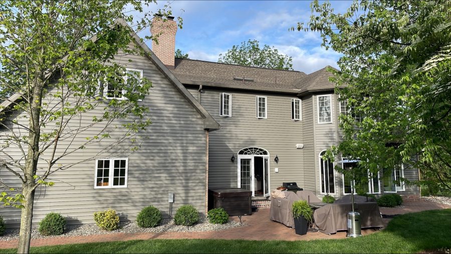Back of home in Allentown, PA, after completed residential exterior painting project by CertaPro Painters of the Greater Lehigh Valley - Angle 2