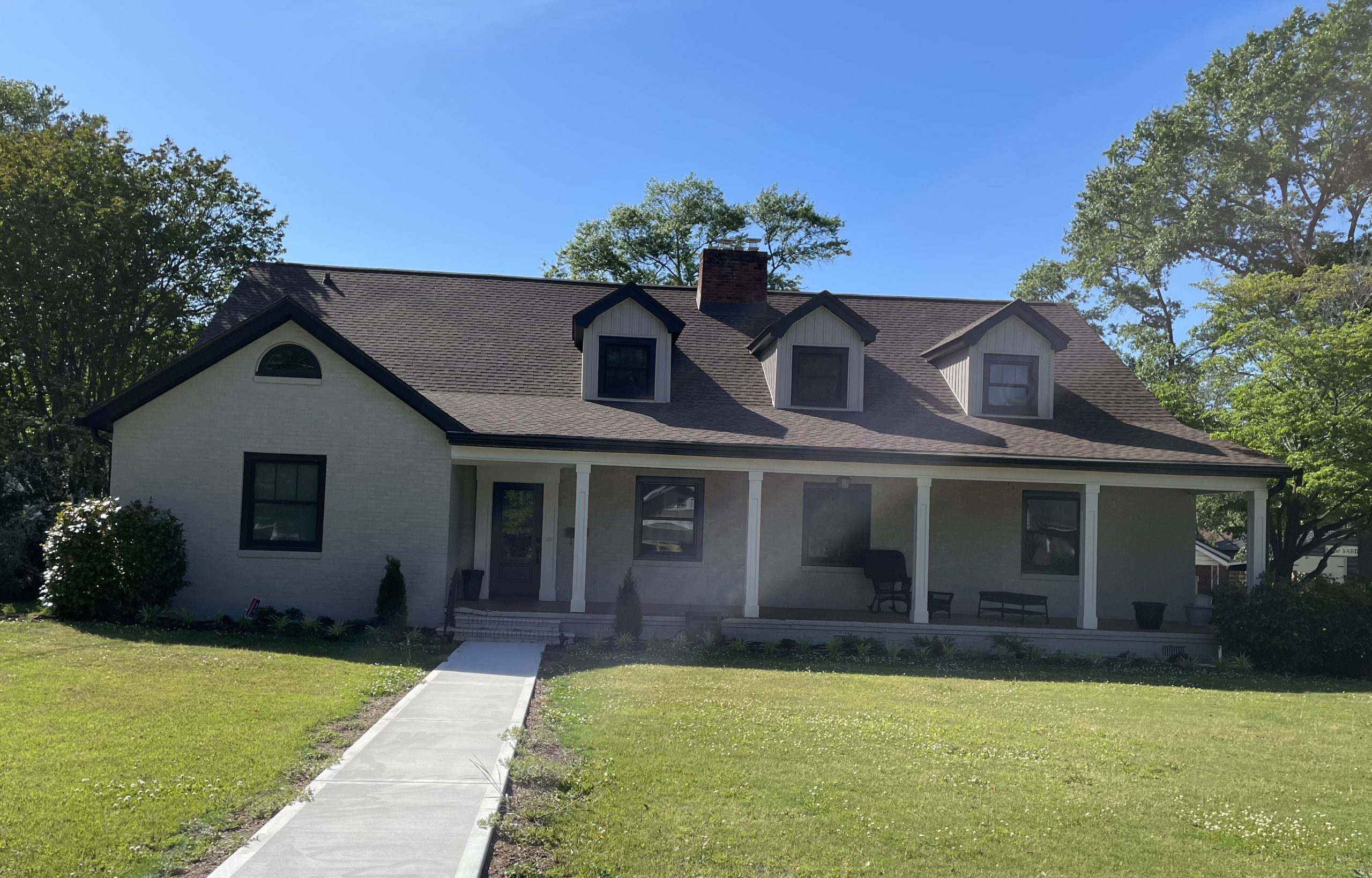 White brick house after exterior painting project