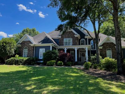 Stone home exterior after painting in anderson, sc