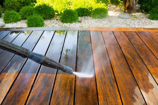 Power washing deck before staining