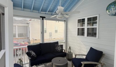 screened porch with blue painted ceiling