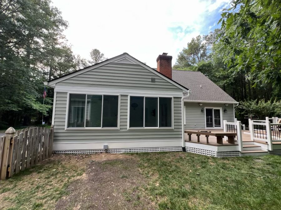 rear side of house with repainted pale green siding Preview Image 1