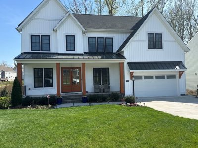 white house exterior and stained columns after refresh