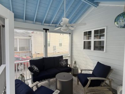 screened porch with blue painted ceiling