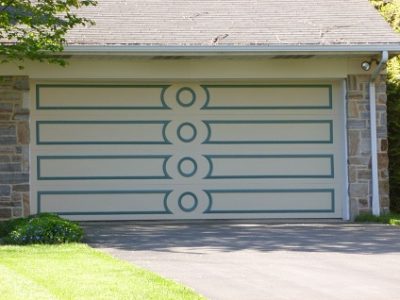 Exterior garage door painting by CertaPro house painters in Camp Hill, PA