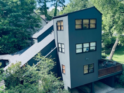 Aerial view of blue house after painting project