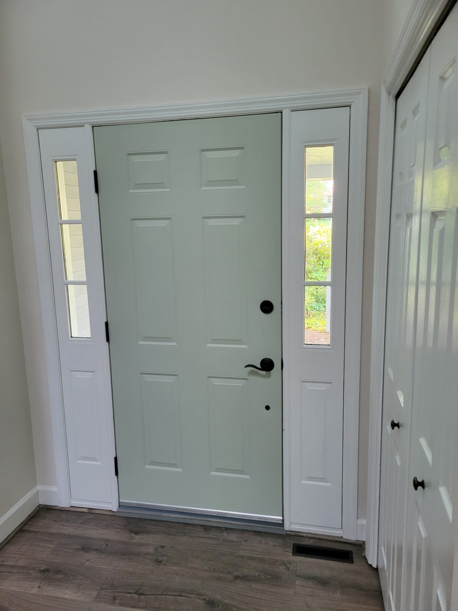 Light green residential front door with white frame interior Preview Image 3