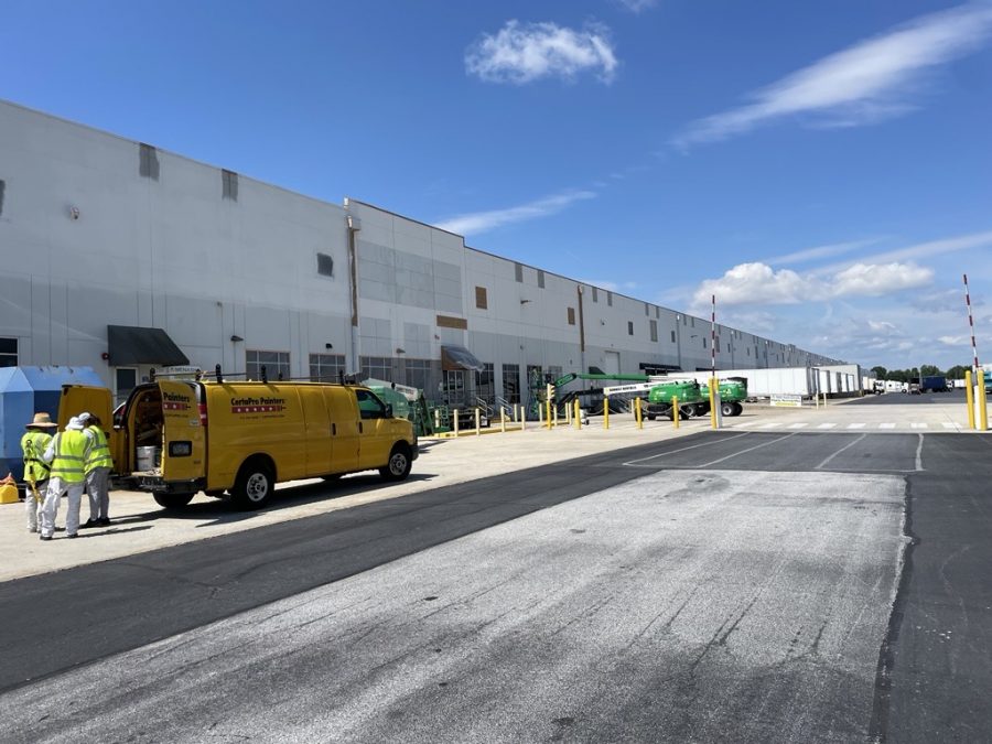warehouse exterior during painting Preview Image 1
