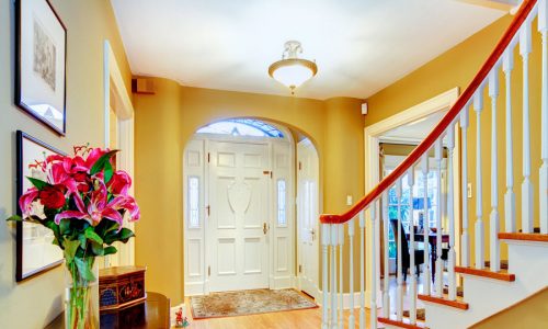 entry way with yellow walls