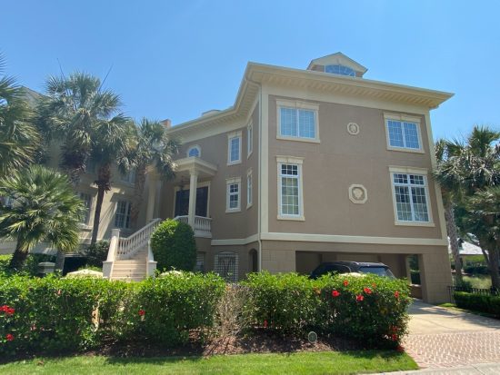 Exterior Stucco House Painting with a beige coat of paint