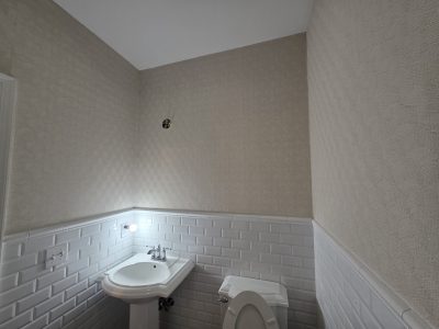 home bathroom with wallpaper and paint