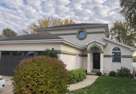 front entrance of stucco house