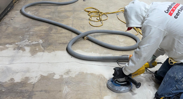 painter grinding commercial flooring