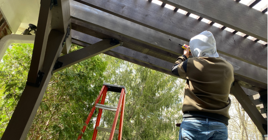 man working on pergola