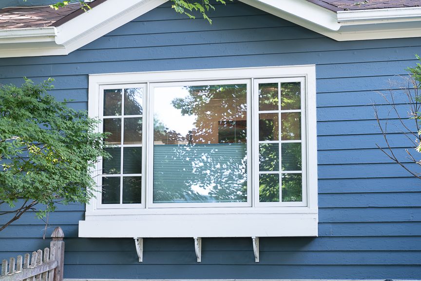 blue painting siding with white window trim Preview Image 1