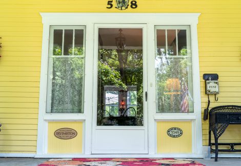 Historic home painted yellow and white