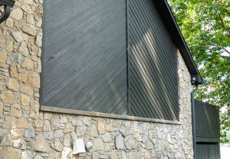 dark gray painted wood siding exterior