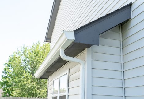 side view of soffits and gutter after painting