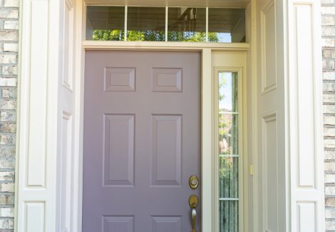 painted front door on white brick home
