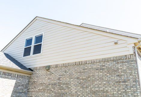 siding and trim on side of house after painting