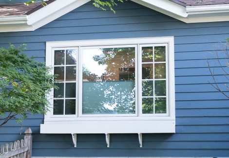blue painting siding with white window trim