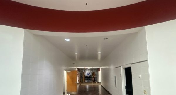 repainted white school lobby walls with red stripe
