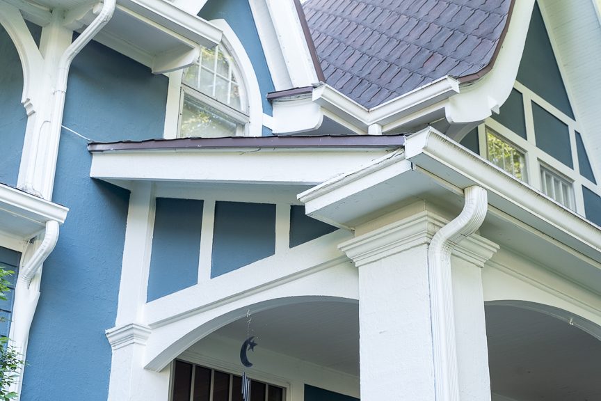 white posts and gutters on blue home Preview Image 10