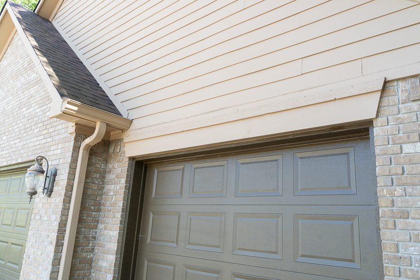 close up of garage door and siding after being painted Preview Image 3