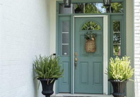 brick house painted green front door